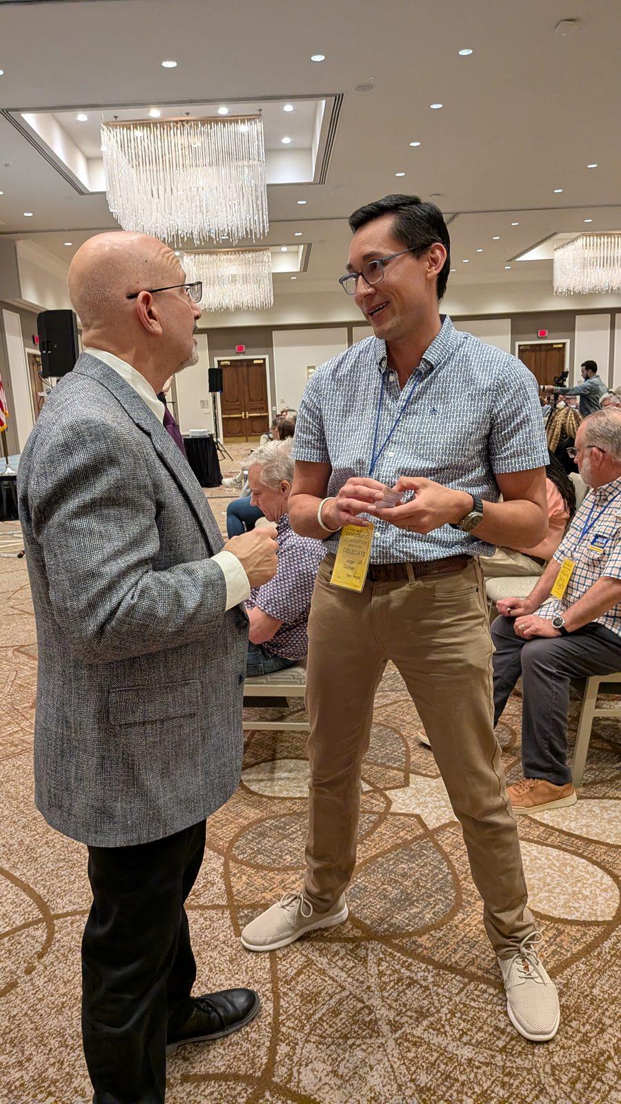 Jon Rosenthal talking with an attendee